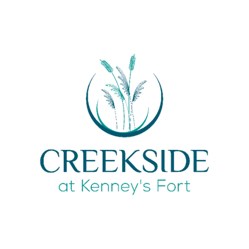 A logo for Creekside at Kenney